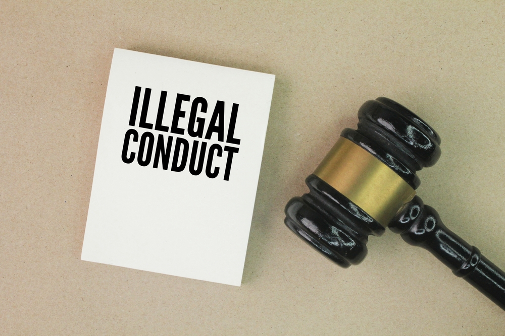 Judge's,Gavel,And,Paper,With,The,Words,Illegal,Conduct.,Illegal